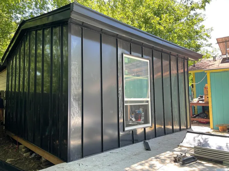 Black standing seam metal wall panels for Roof Inspection in Garden City